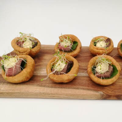 Roast rare beef on Yorkshire pudding with horseradish mayo