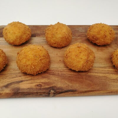 Crumbed pumpkin and kumara balls with chutney