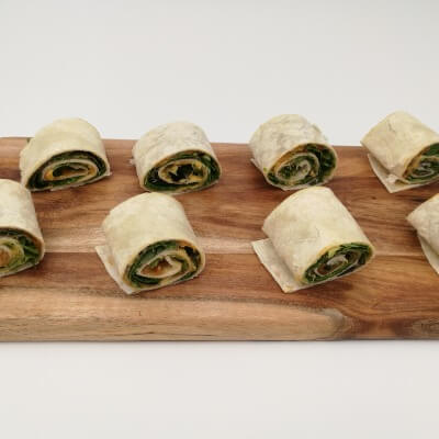 Spinach, tomato relish & hummus pinwheel wrap bite