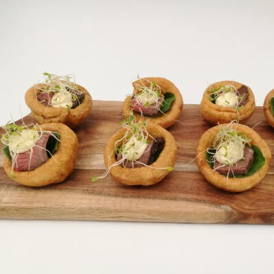 Roast rare beef on Yorkshire pudding with horseradish mayo